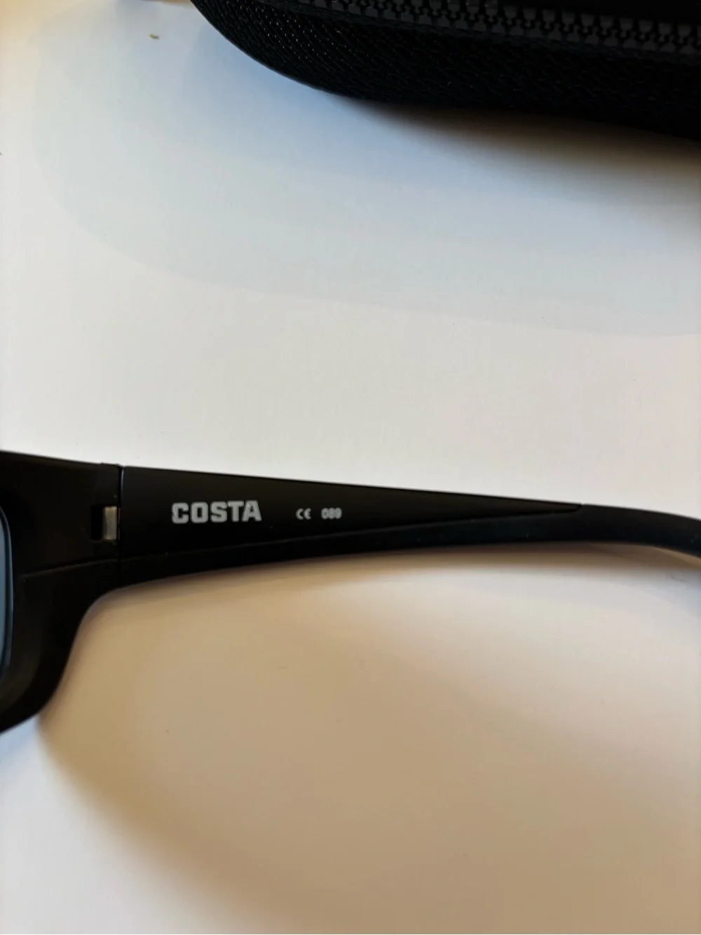 Costa Jose JO 01 Sunglasses in Black with Blue Zip Case Accent